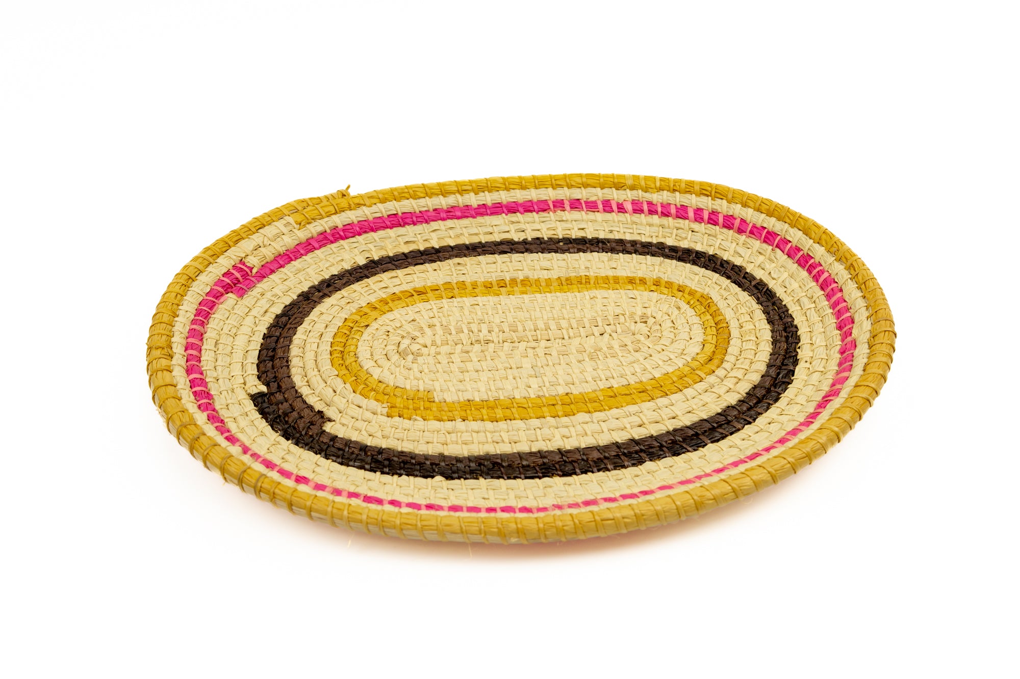 Pink, gold, brown and white.  Oval design. Hand woven plate basket. Made in Panama.