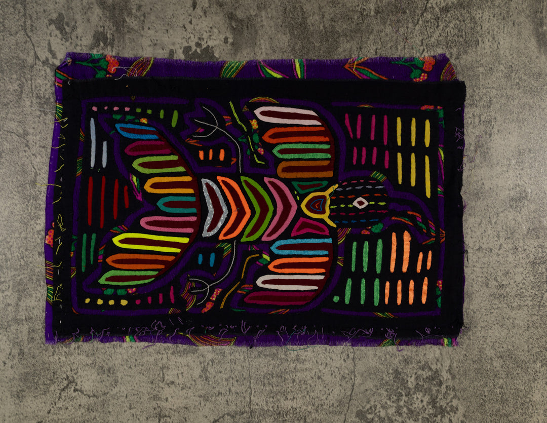 Panama mola panel, striped wings and a chevron body on black, hand stitched reverse applique