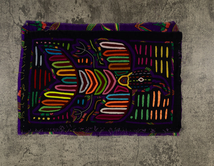 Panama mola panel, striped wings and a chevron body on black, hand stitched reverse applique