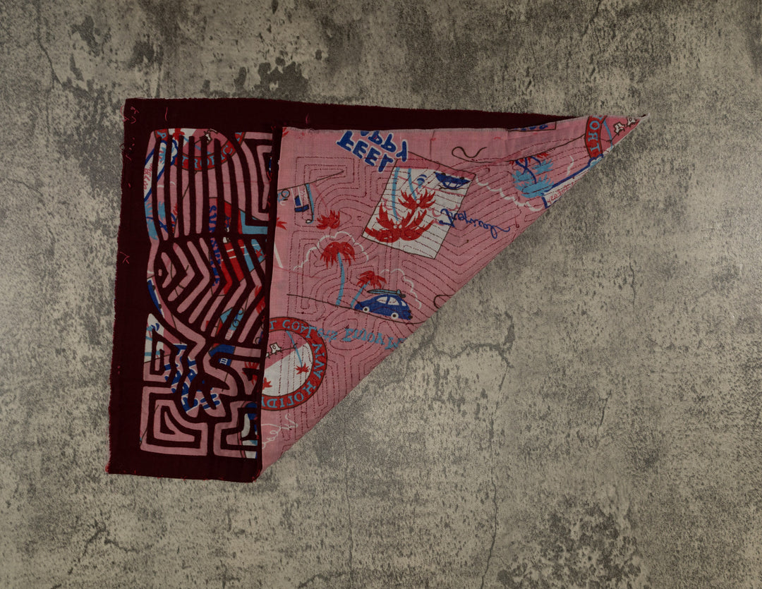 Hand stitched Guna mola from Guna Yala Panama, mirrored birds over a printed background cloth