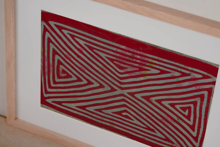 Hand stitched Guna mola from Guna Yala Panama, red channels over gray cloth with pink roses