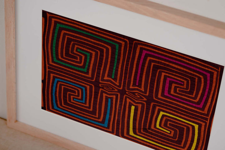 Maroon and orange four square spirals mola, hand stitched Guna panel from Panama, 15 by 11 inches