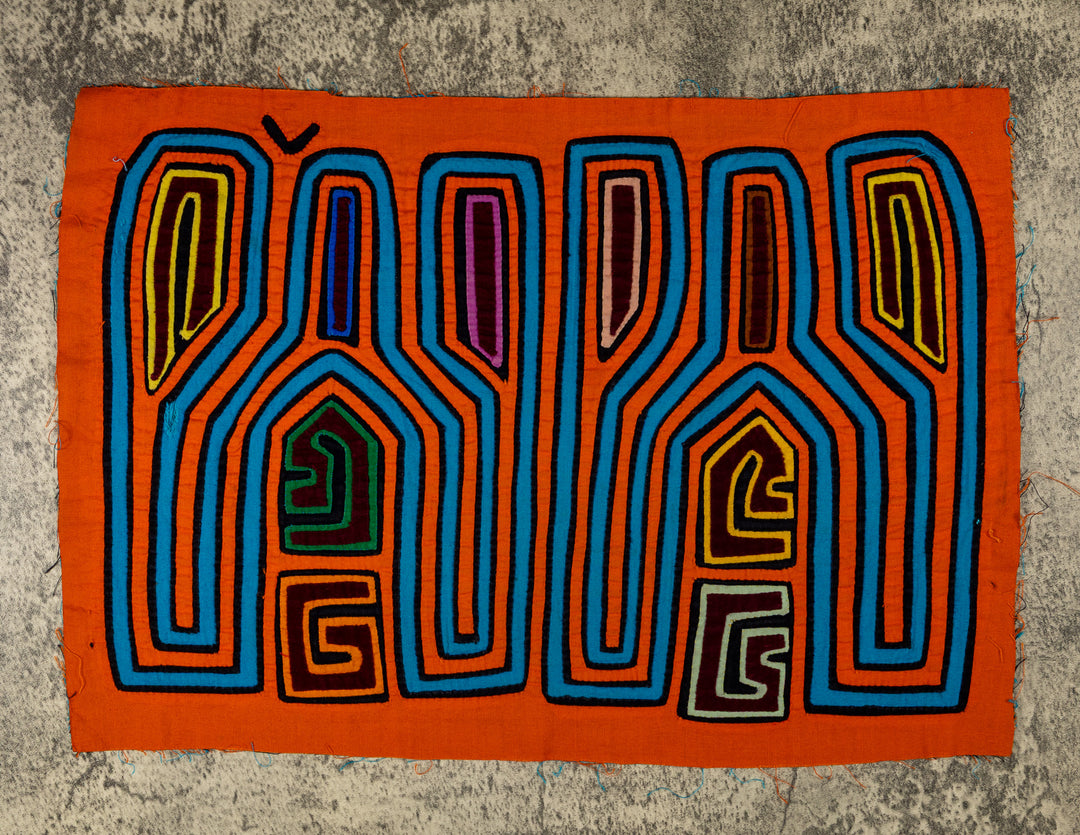 Panama mola panel, tall tuning fork shapes in blue and orange stripes, hand stitched reverse applique
