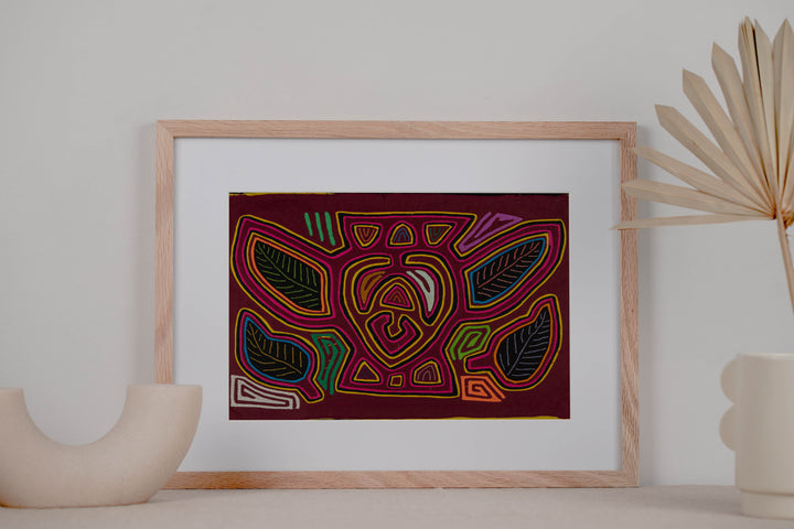 Panama mola panel, bumblebee shape with leaf wings outlined in pink on maroon, hand stitched reverse applique