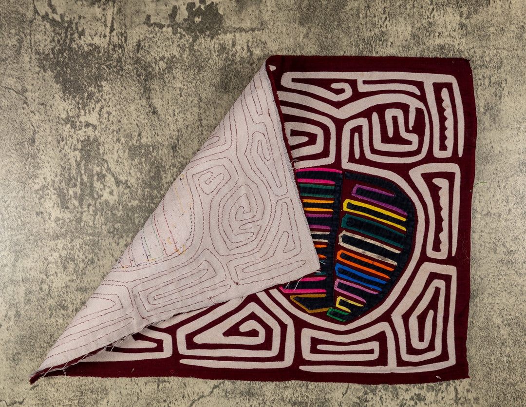 Hand stitched Guna mola from Guna Yala Panama, white maze channels around the fruit