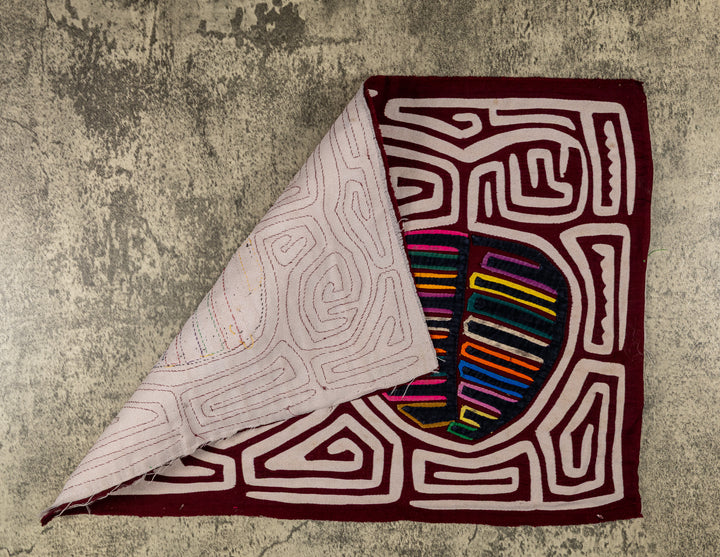 Hand stitched Guna mola from Guna Yala Panama, white maze channels around the fruit