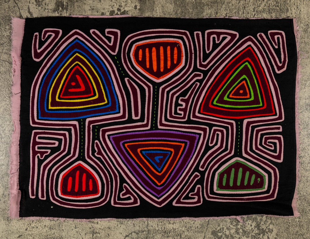 Panama mola panel, triangles and cup shapes in a pink maze on black, hand stitched reverse applique