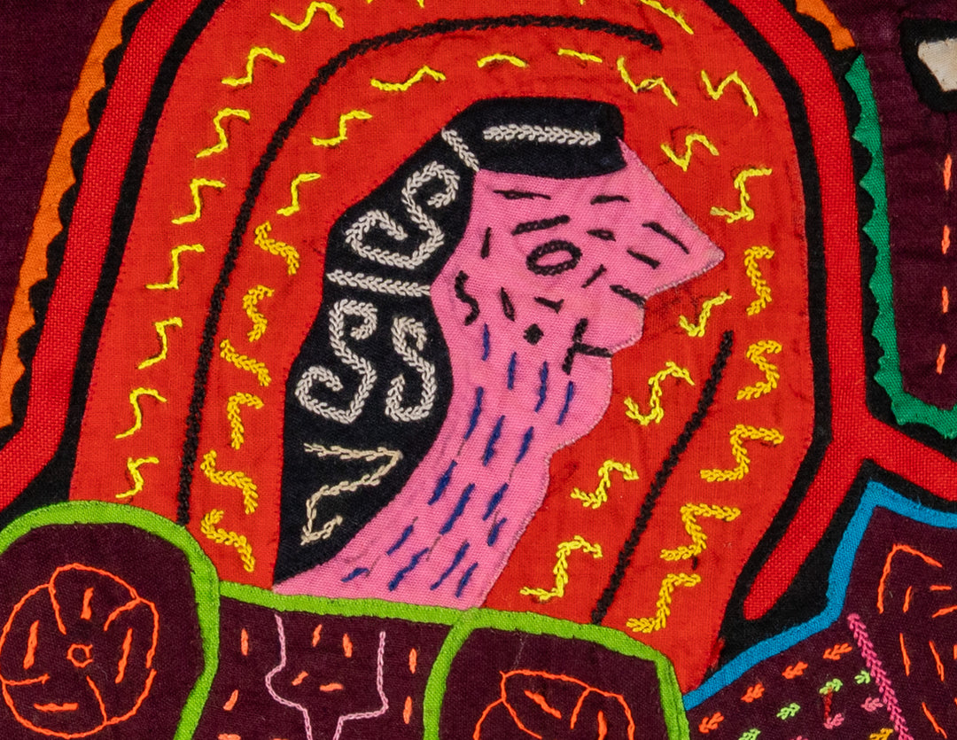 Nativity with women and baby mola, hand stitched Guna panel from Panama, 14 by 12 inches