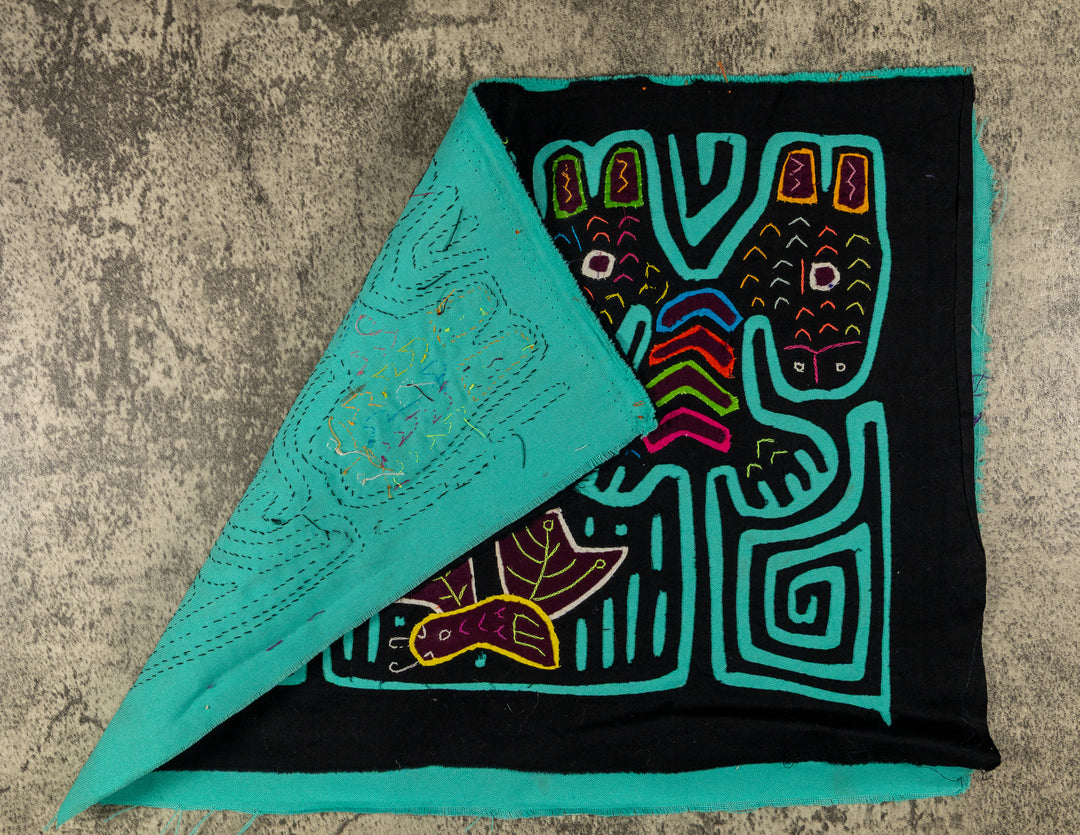 Hand stitched Guna mola from Guna Yala Panama, turquoise outlines on the long ears