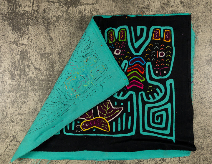 Hand stitched Guna mola from Guna Yala Panama, turquoise outlines on the long ears