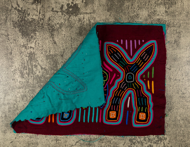 Hand stitched Guna mola from Guna Yala Panama, flower and leaves between the crosses