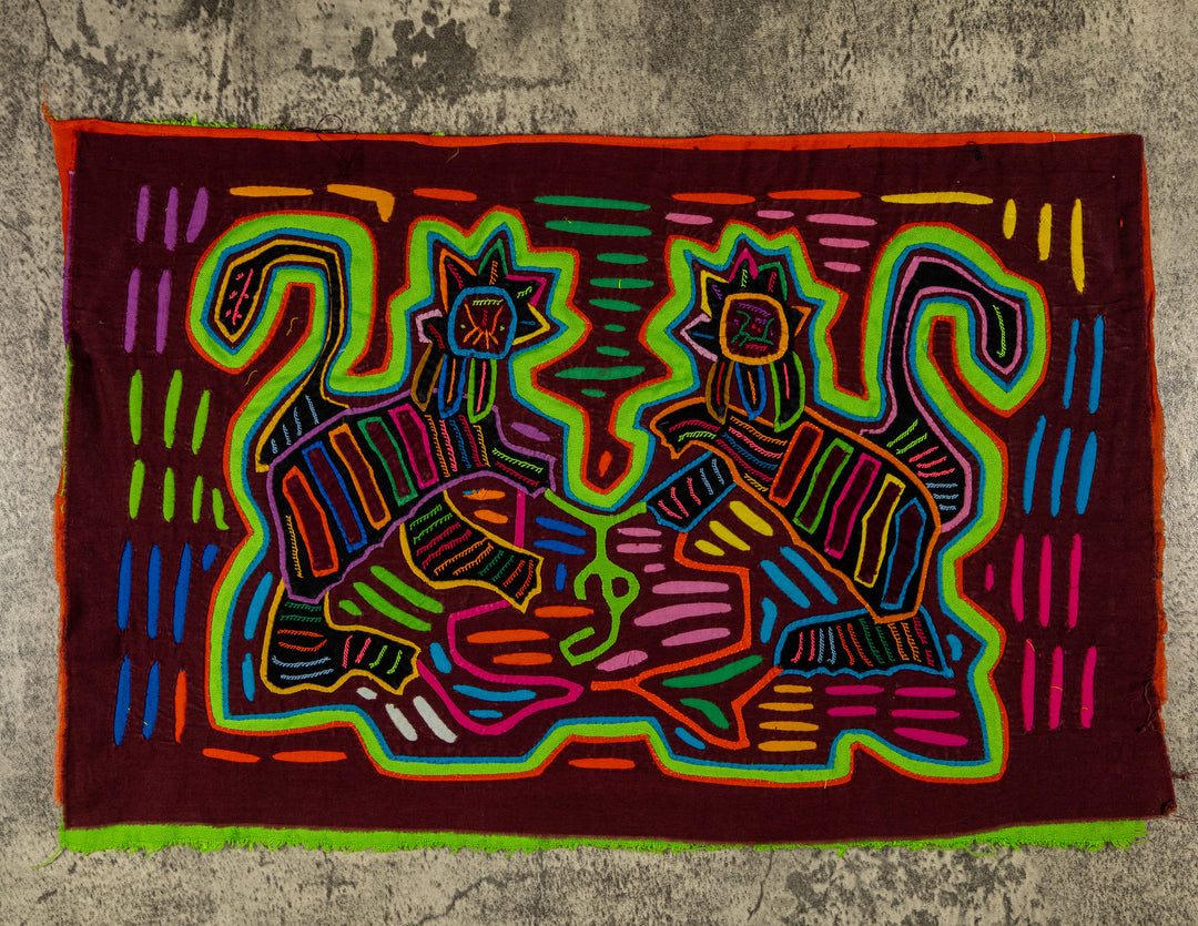 Panama mola panel, two cats with star faces and striped bodies on maroon, hand stitched reverse applique