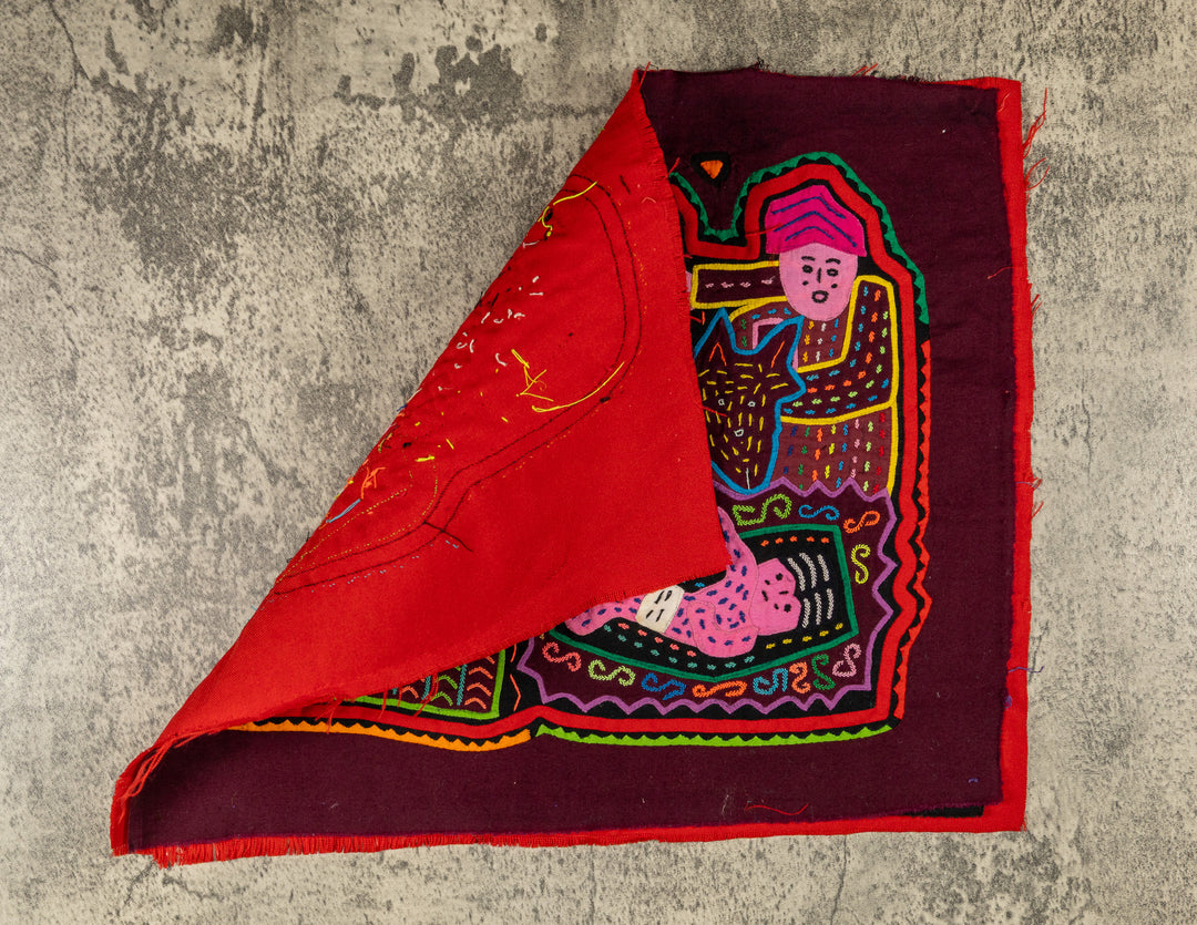 Hand stitched Guna mola from Guna Yala Panama, small child and torch beside the baby