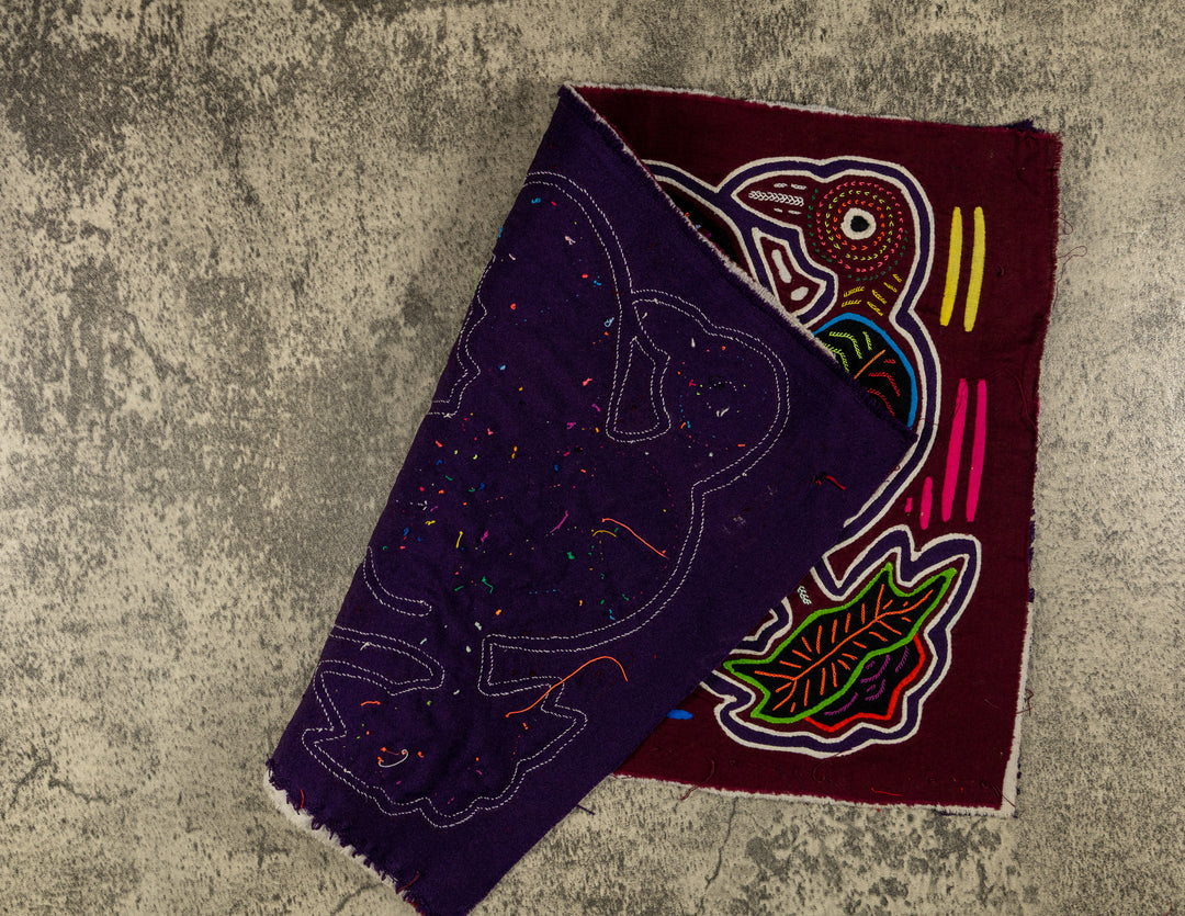 Hand stitched Guna mola from Guna Yala Panama, white outlines on the huge bills