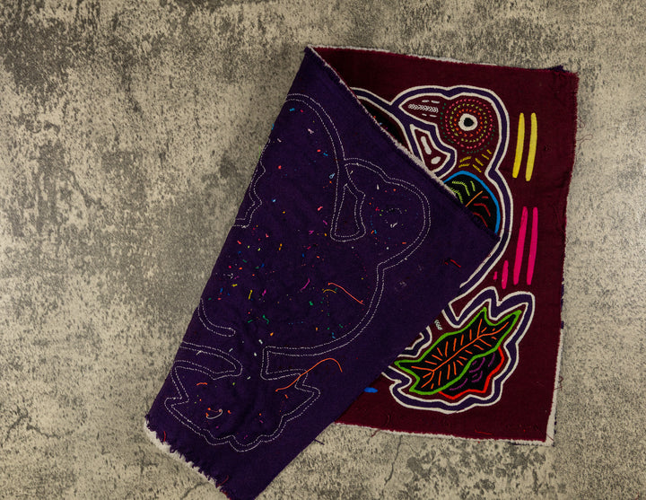 Hand stitched Guna mola from Guna Yala Panama, white outlines on the huge bills