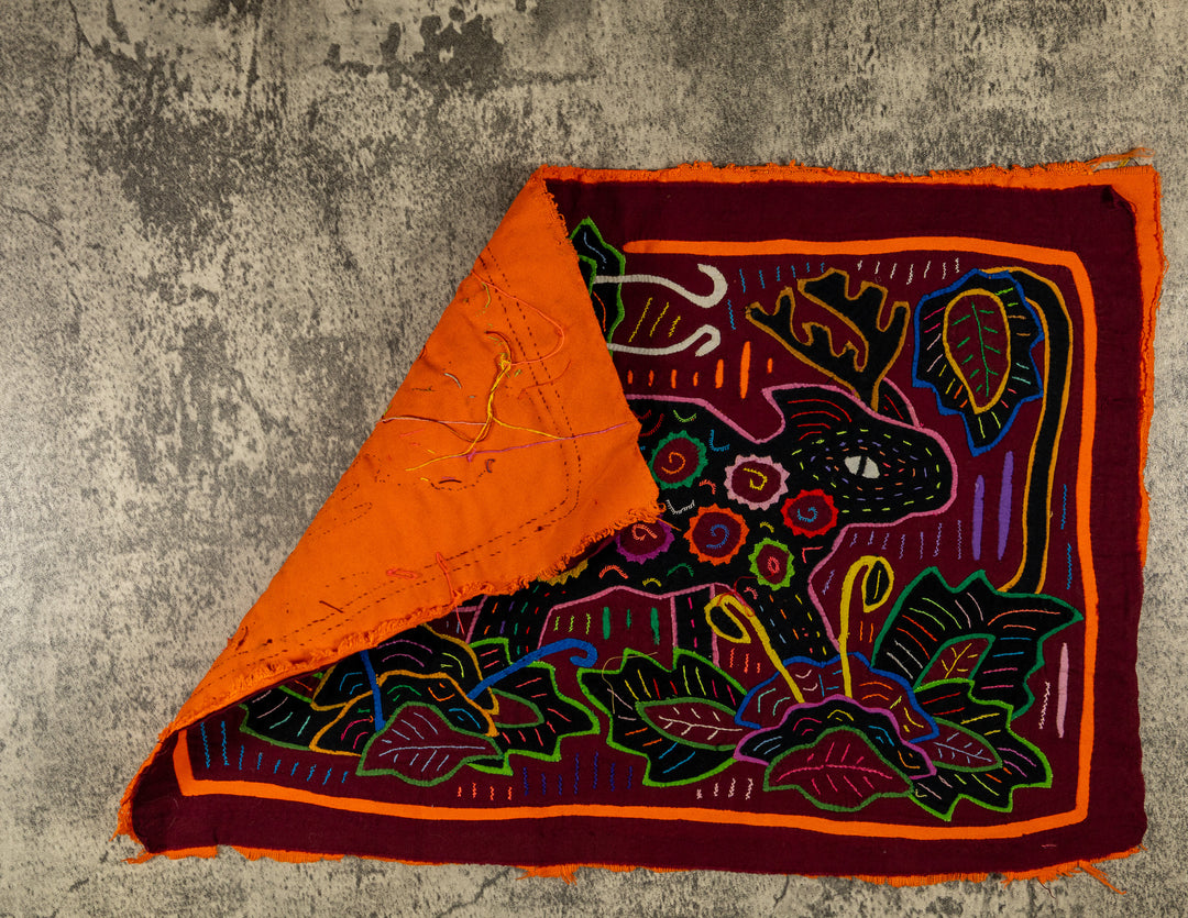 Hand stitched Guna mola from Guna Yala Panama, spiral spots across the body