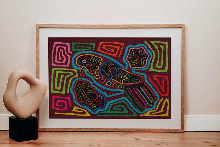 Panama mola panel, turquoise parrot with a tiny beak and striped tail on maroon, hand stitched reverse applique