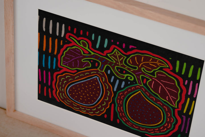 Hand stitched Guna mola from Guna Yala Panama, red outlines on the broad leaves