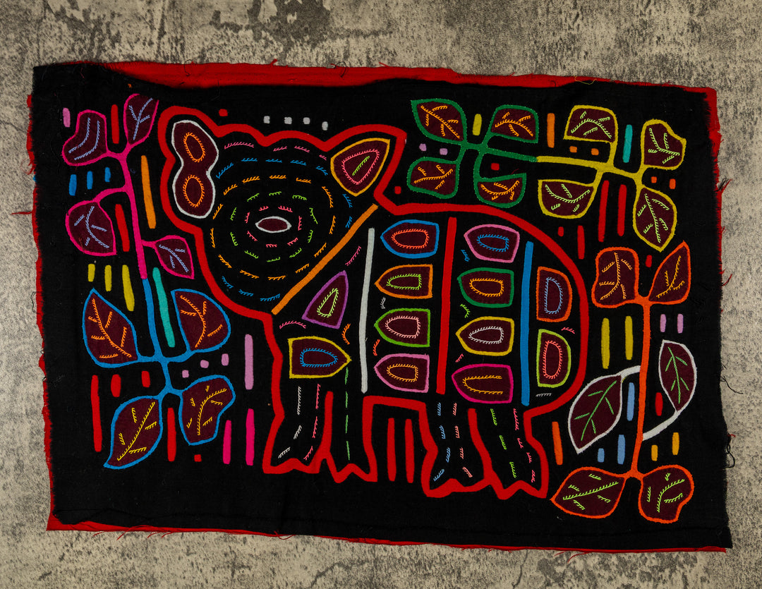 Panama mola panel, wild pig with a big ear and spots among leaves on black, hand stitched reverse applique