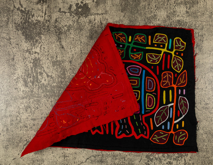 Hand stitched Guna mola from Guna Yala Panama, red outlines on the spots and leaves