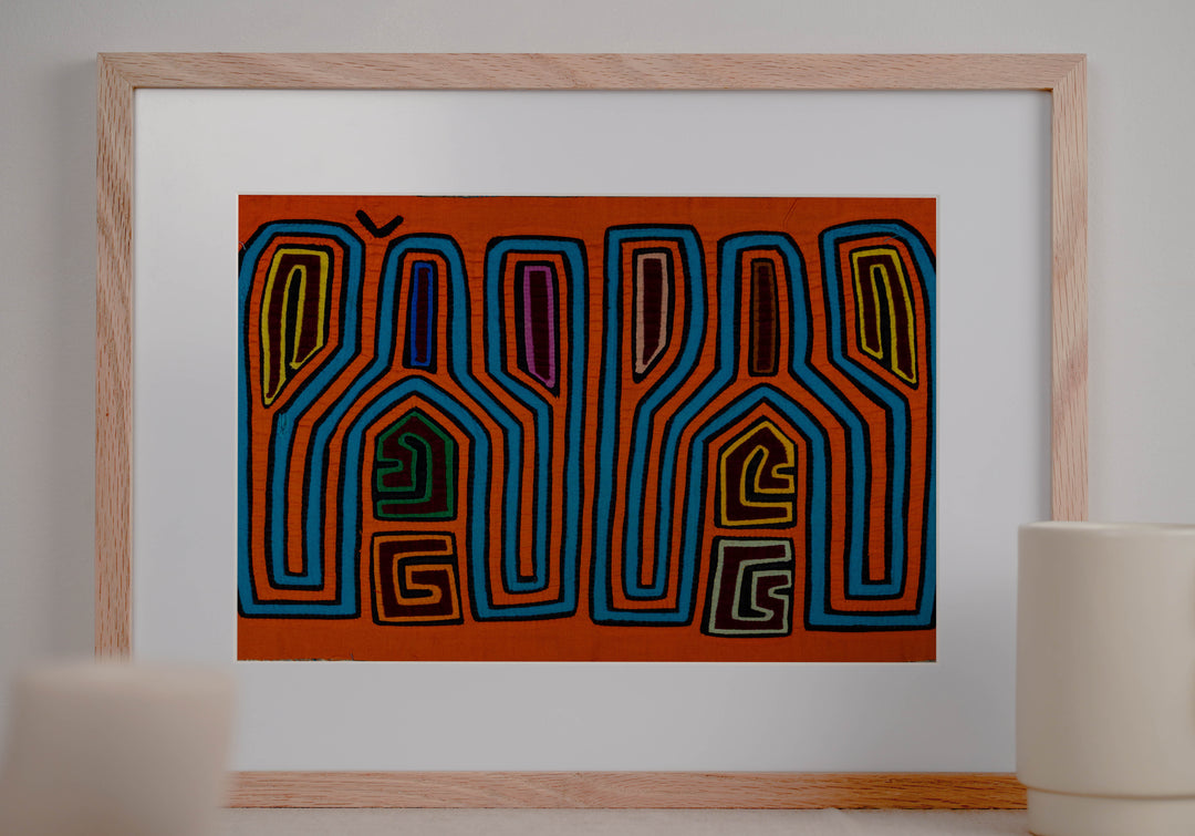 Panama mola panel, tall tuning fork shapes in blue and orange stripes, hand stitched reverse applique