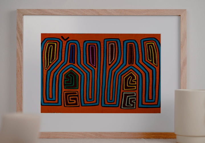Panama mola panel, tall tuning fork shapes in blue and orange stripes, hand stitched reverse applique