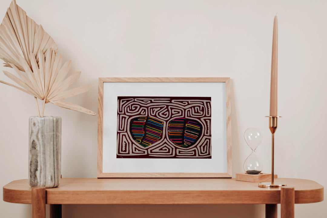 Hand stitched Guna mola from Guna Yala Panama, white maze channels around the fruit