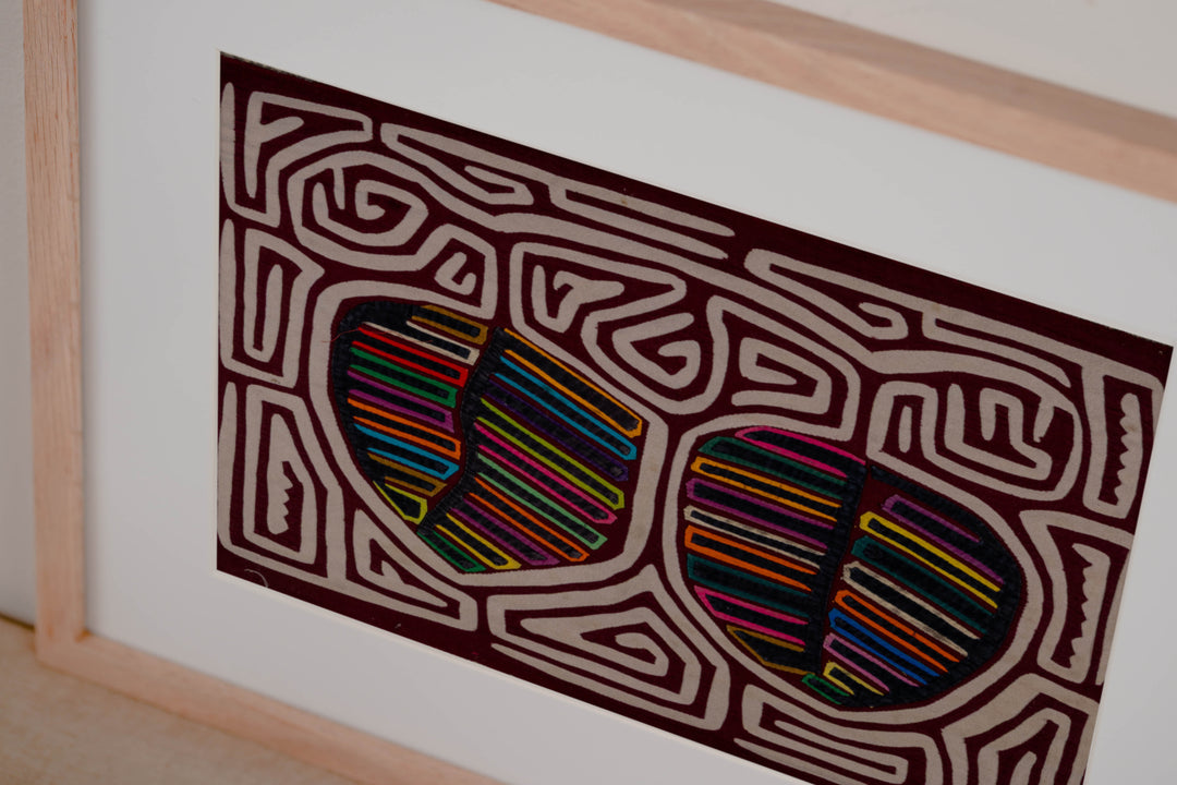 Hand stitched Guna mola from Guna Yala Panama, white maze channels around the fruit