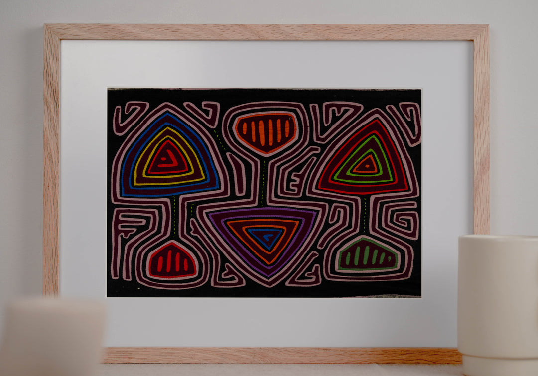 Panama mola panel, triangles and cup shapes in a pink maze on black, hand stitched reverse applique