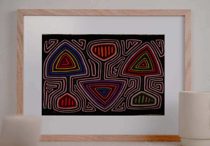 Panama mola panel, triangles and cup shapes in a pink maze on black, hand stitched reverse applique