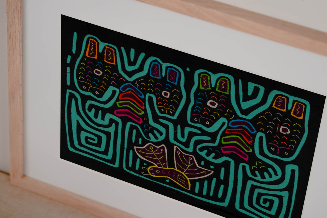 Hand stitched Guna mola from Guna Yala Panama, turquoise outlines on the long ears