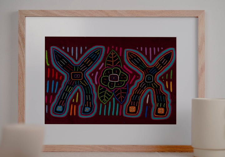 Panama mola panel, two big crossed shapes with a flower and leaves on maroon, hand stitched reverse applique