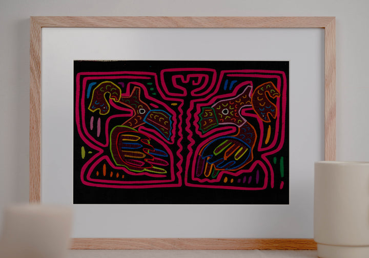 Panama mola panel, two long billed birds each holding a fish in a pink maze on black, hand stitched reverse applique