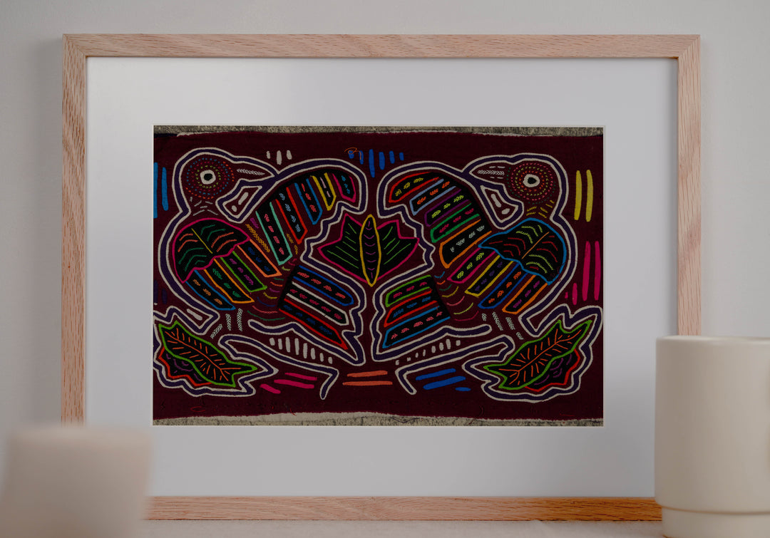 Panama mola panel, two big billed striped birds among leaves on maroon, hand stitched reverse applique