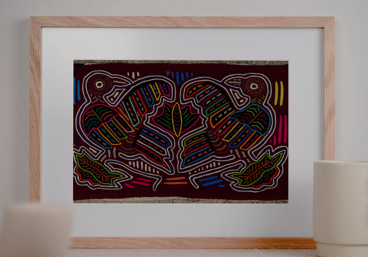 Panama mola panel, two big billed striped birds among leaves on maroon, hand stitched reverse applique