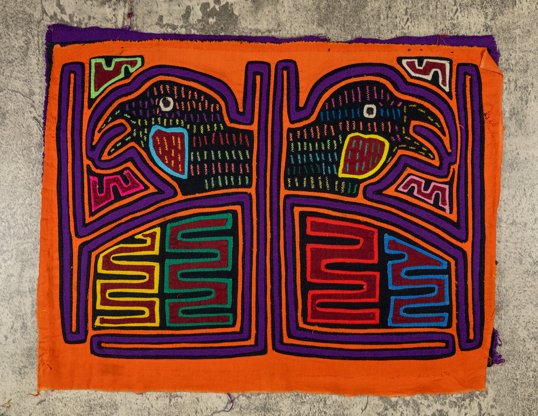 Panama mola panel, two hook billed birds in separate frames on orange, hand stitched reverse applique
