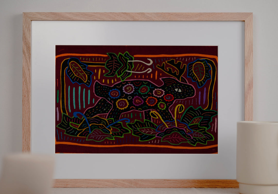 Panama mola panel, small animal with spiral spots among leaves on maroon, hand stitched reverse applique