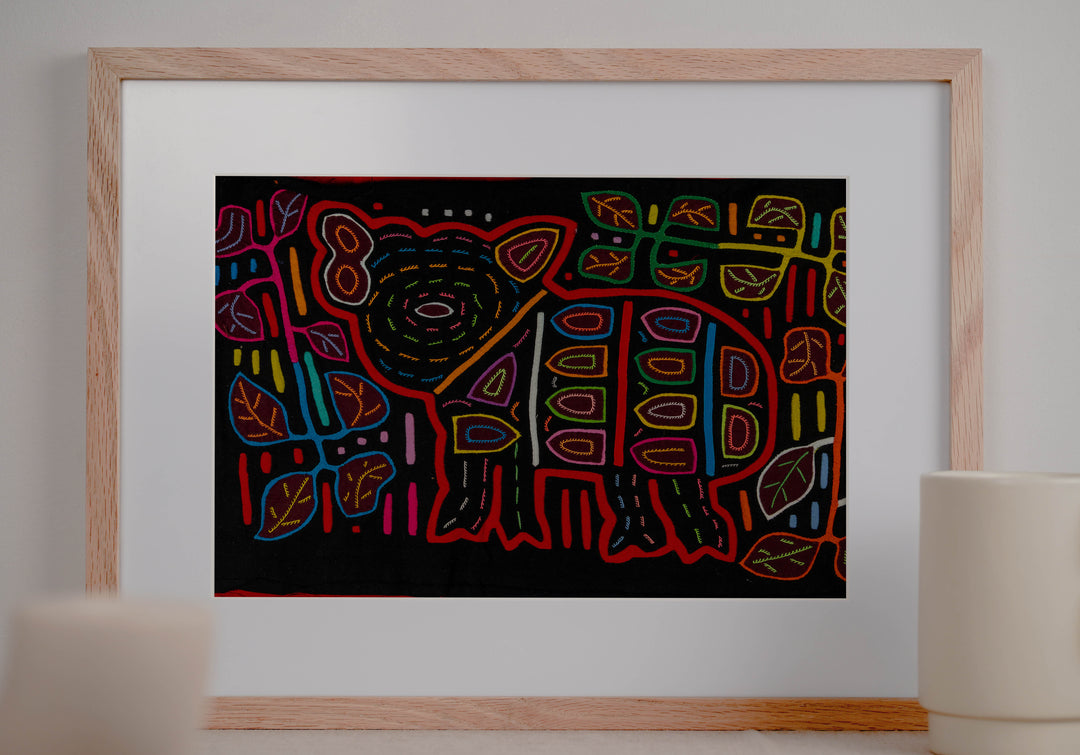 Panama mola panel, wild pig with a big ear and spots among leaves on black, hand stitched reverse applique