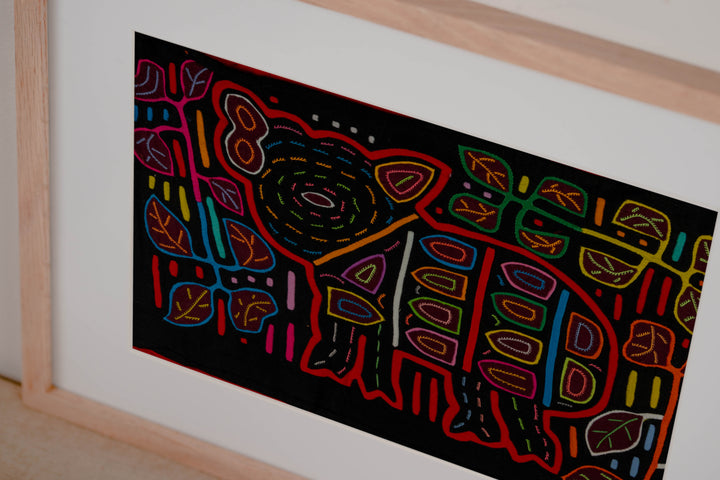 Hand stitched Guna mola from Guna Yala Panama, red outlines on the spots and leaves