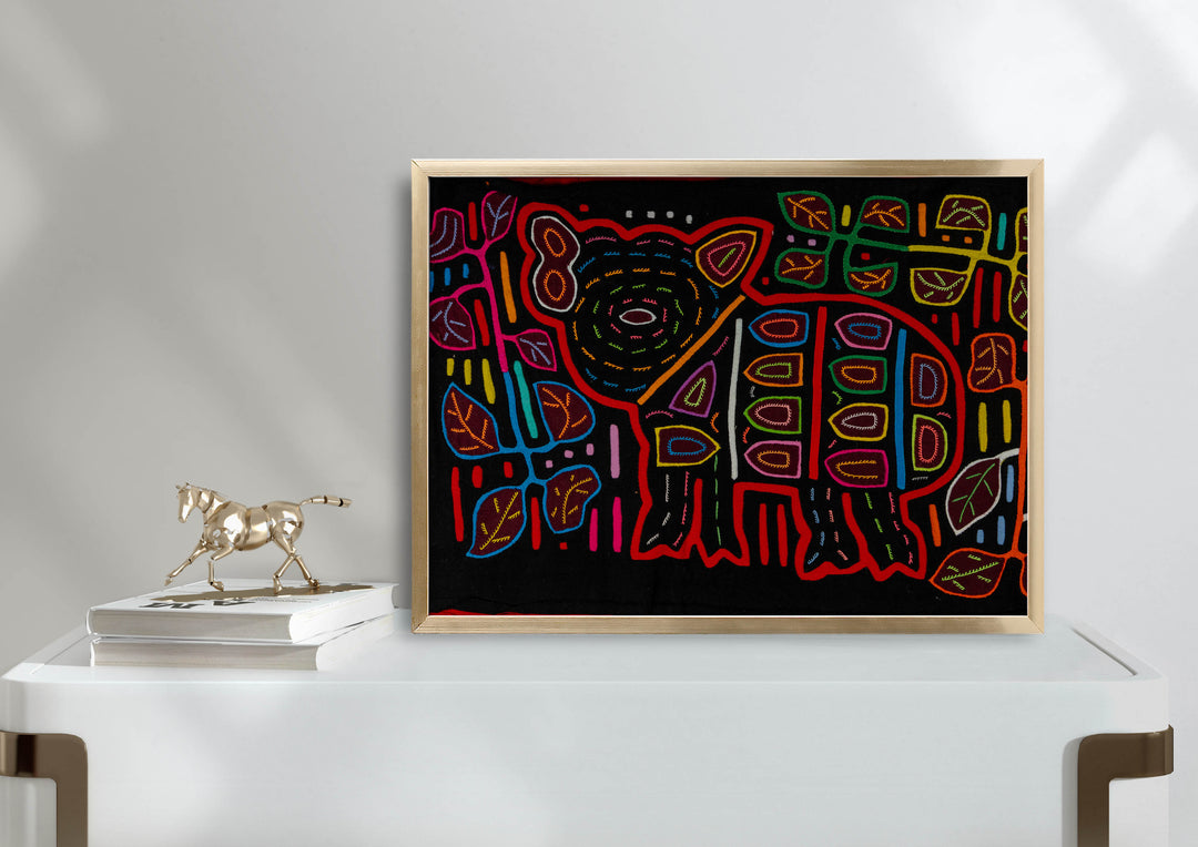Panama mola panel, wild pig with a big ear and spots among leaves on black, hand stitched reverse applique