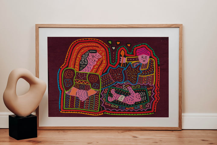 Panama mola panel, woman holding a baby with a torch bearer and a child on maroon, hand stitched reverse applique