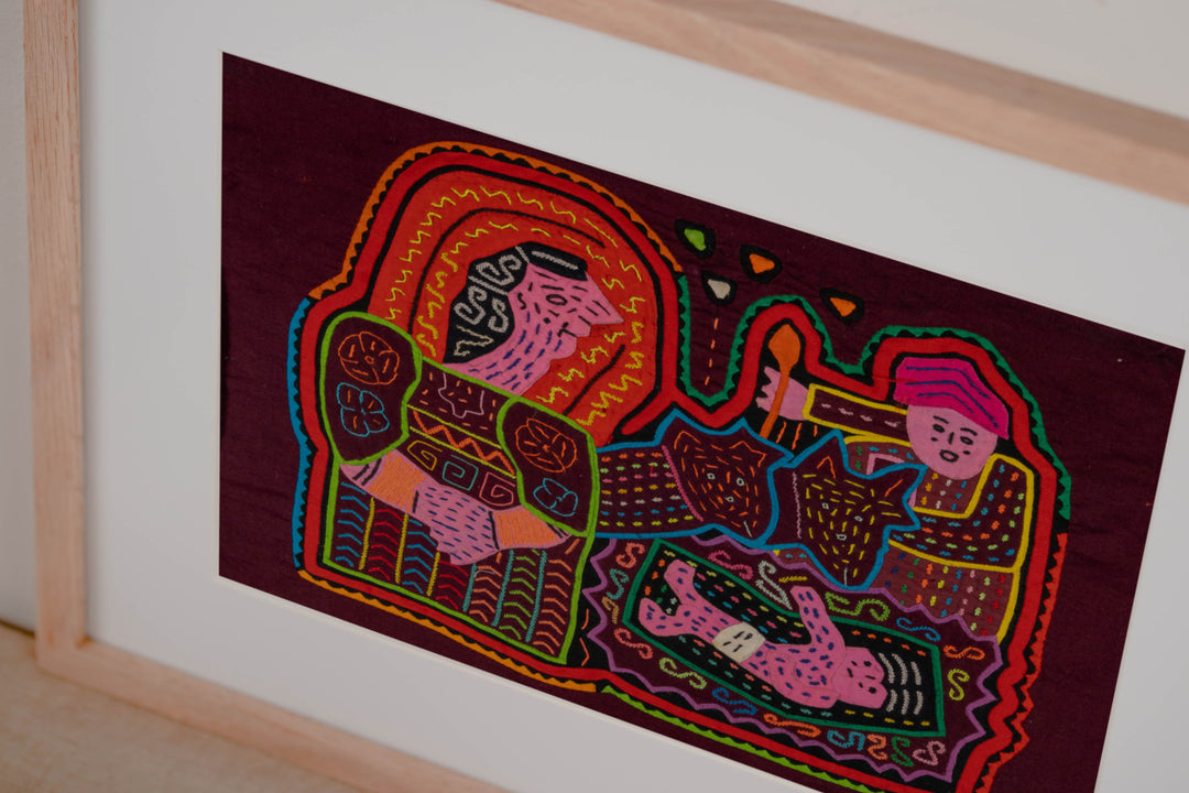 Hand stitched Guna mola from Guna Yala Panama, small child and torch beside the baby