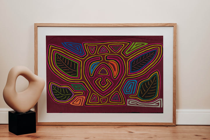Panama mola panel, a plump bumblebee among leaves on maroon, hand stitched reverse applique