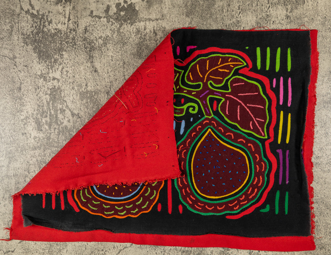 Hand stitched Guna mola from Guna Yala Panama, red outlines on the broad leaves
