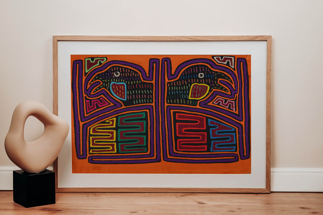 Panama mola panel, two hook billed birds in separate frames on orange, hand stitched reverse applique
