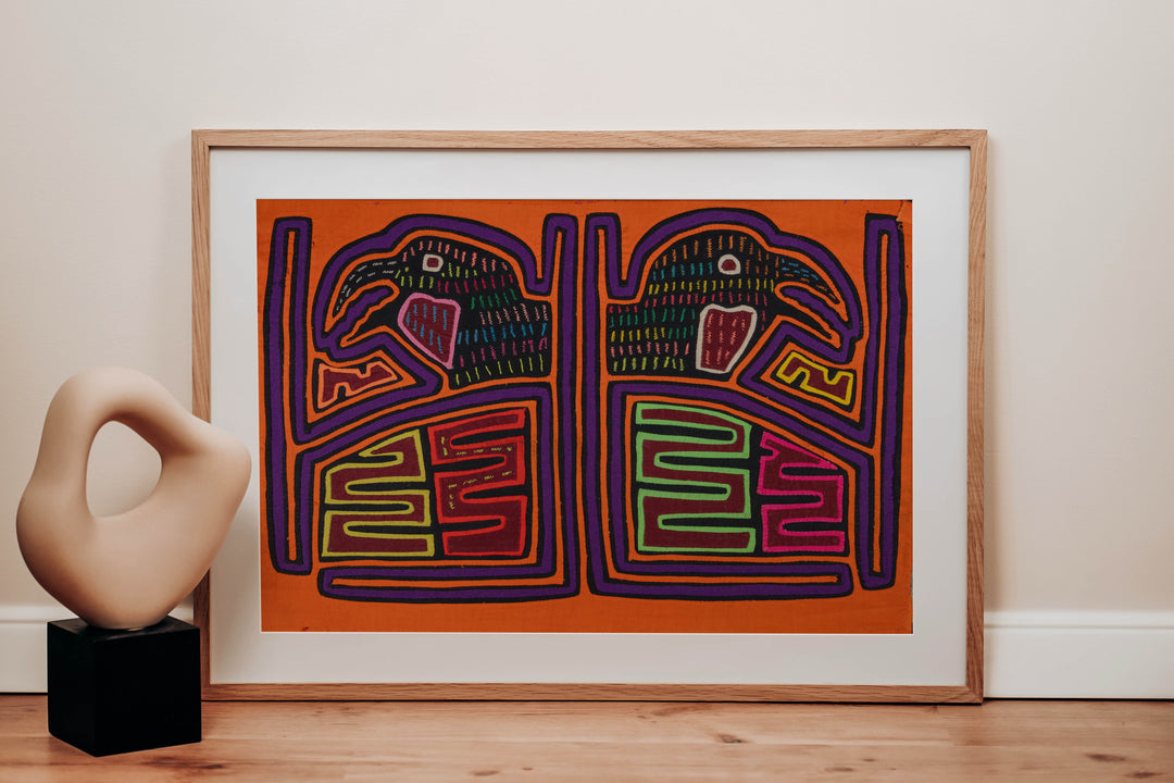 Panama mola panel, pair of hook billed birds in a framed cage on orange, hand stitched reverse applique