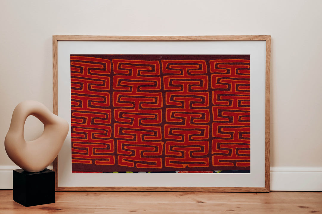 Panama mola panel, orange key pattern on red with a flower band at the lower edge, hand stitched reverse applique