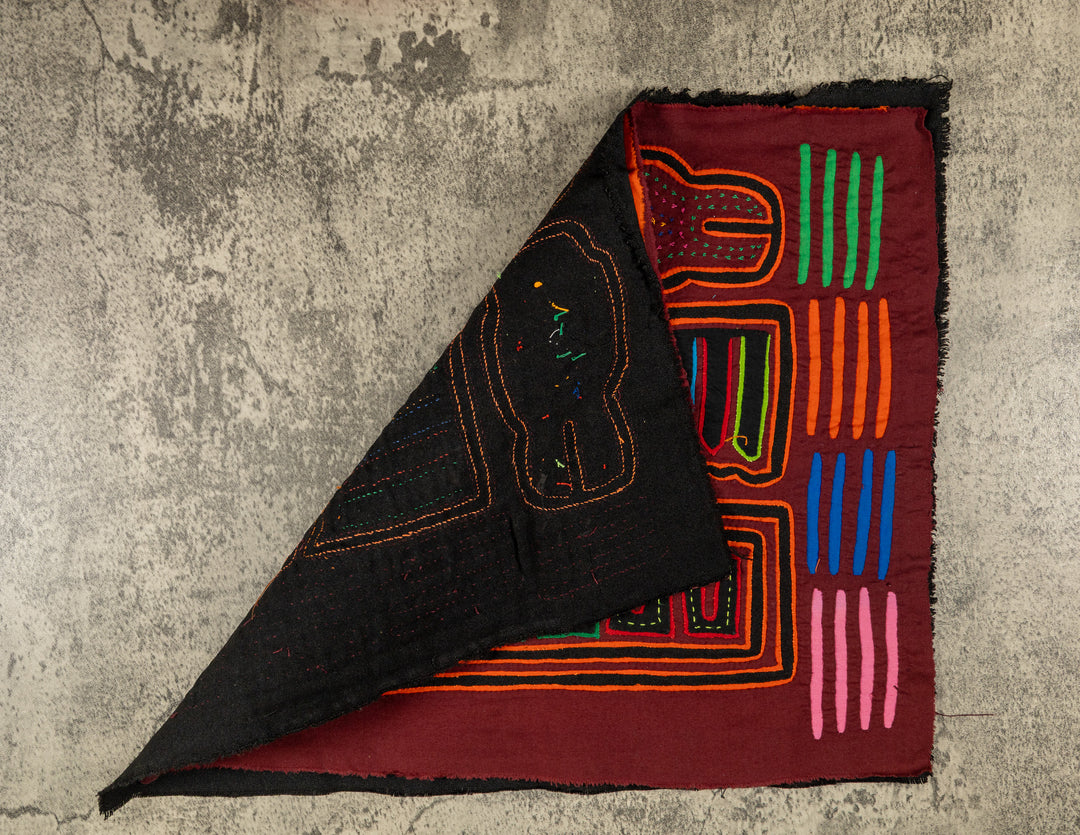 Hand stitched Guna mola from Guna Yala Panama, orange tracing on the hooked bills