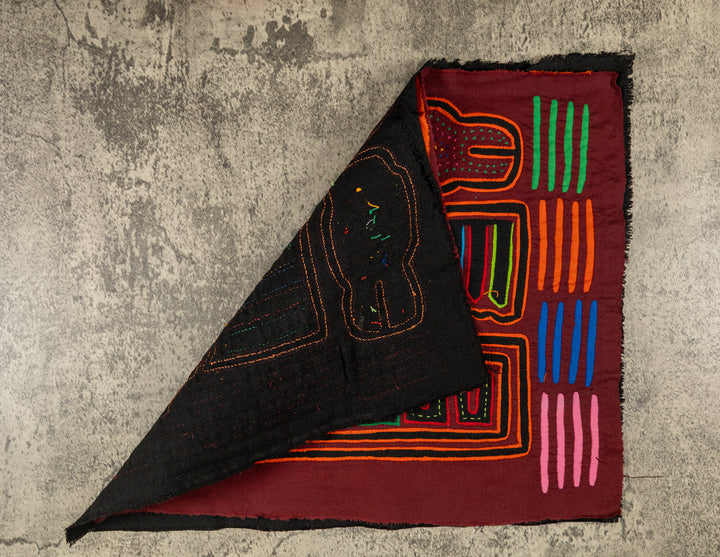 Hand stitched Guna mola from Guna Yala Panama, orange tracing on the hooked bills