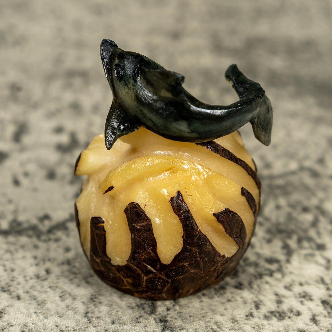 Black And Gray Dolphin Riding Waves Tagua Carving